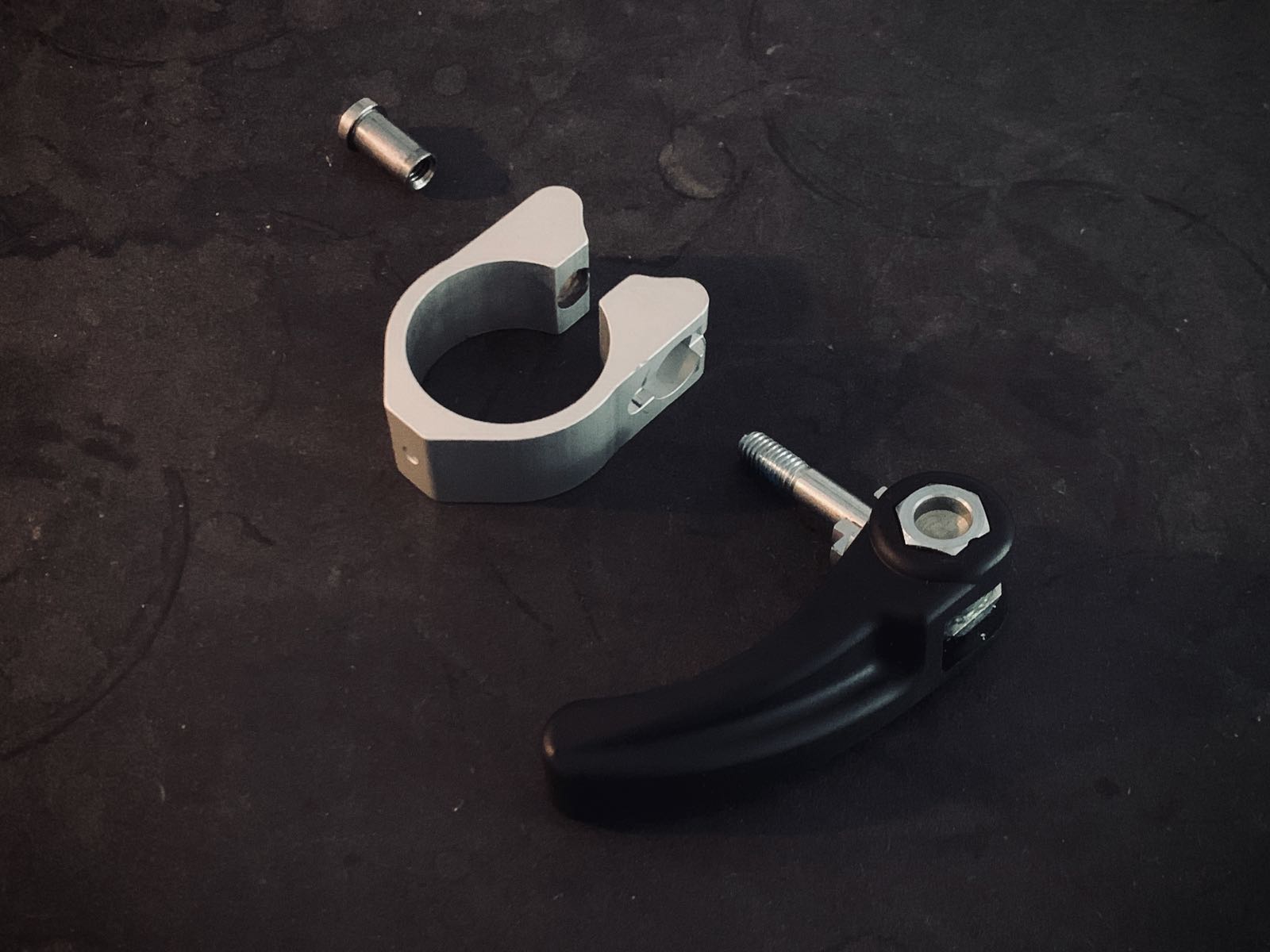 Upper clamp in parts: nut, clamp, quick release lever
