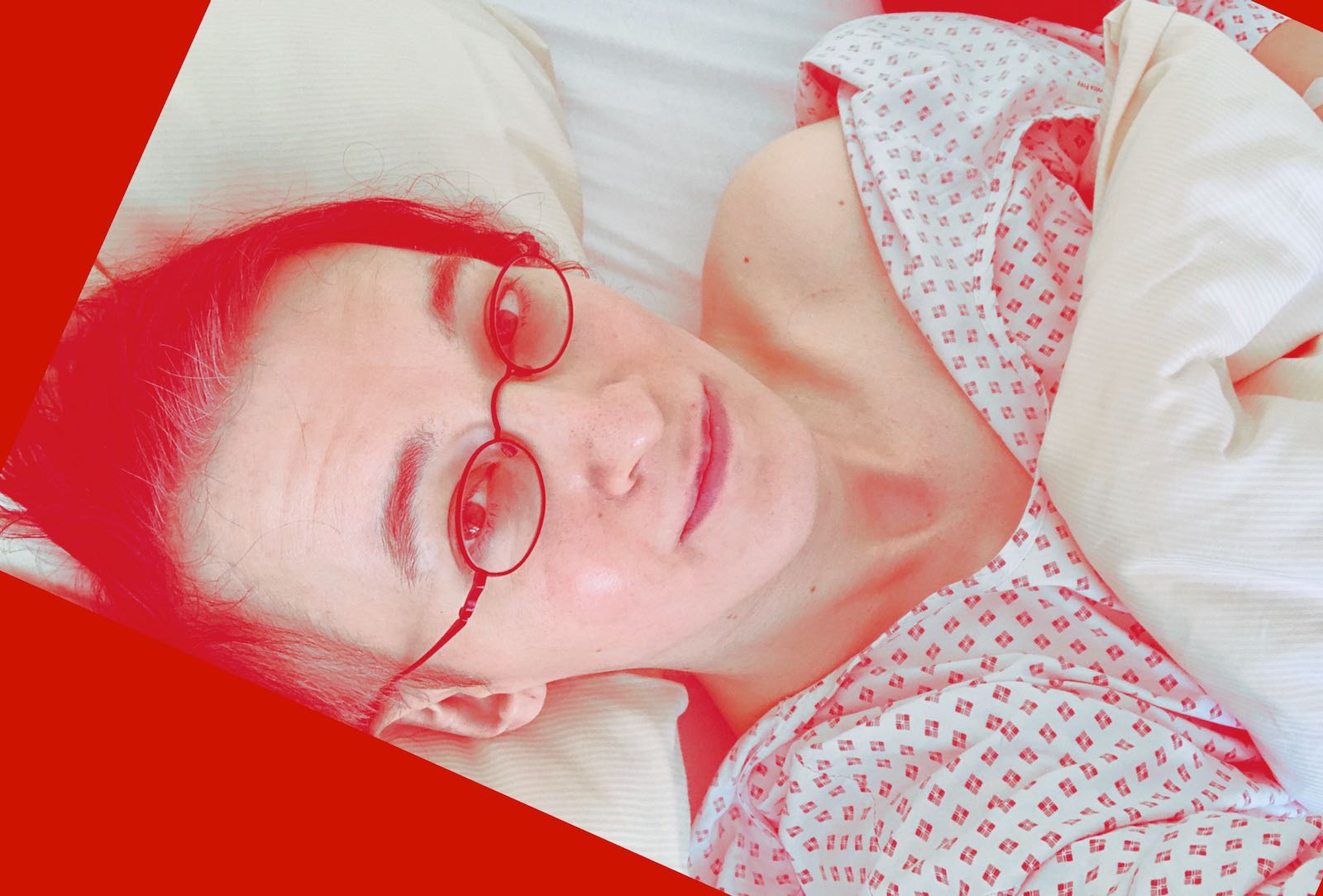 Selfie, lying in a hospital bed