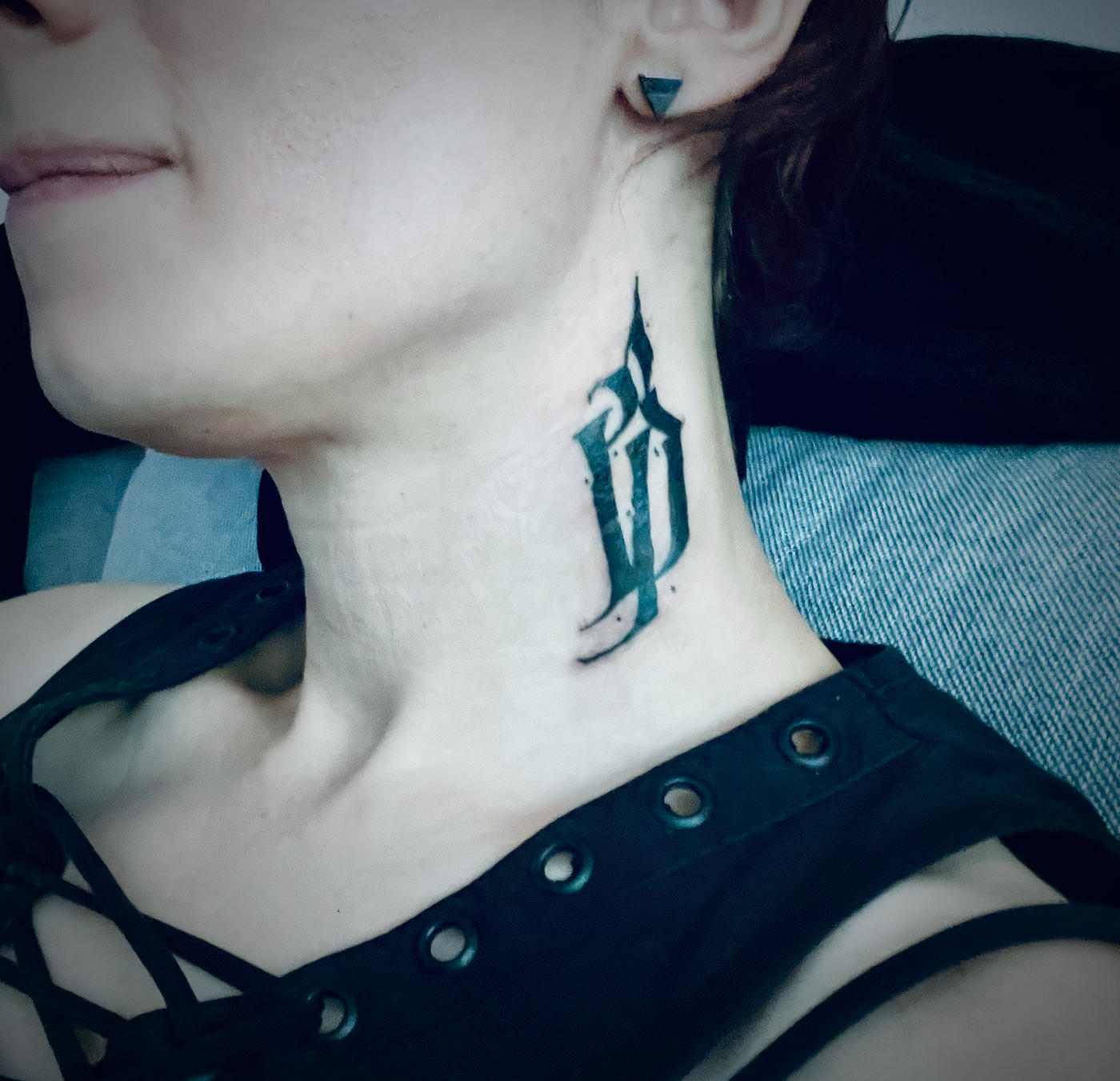Abstract glyph tattoo on the left side of my neck