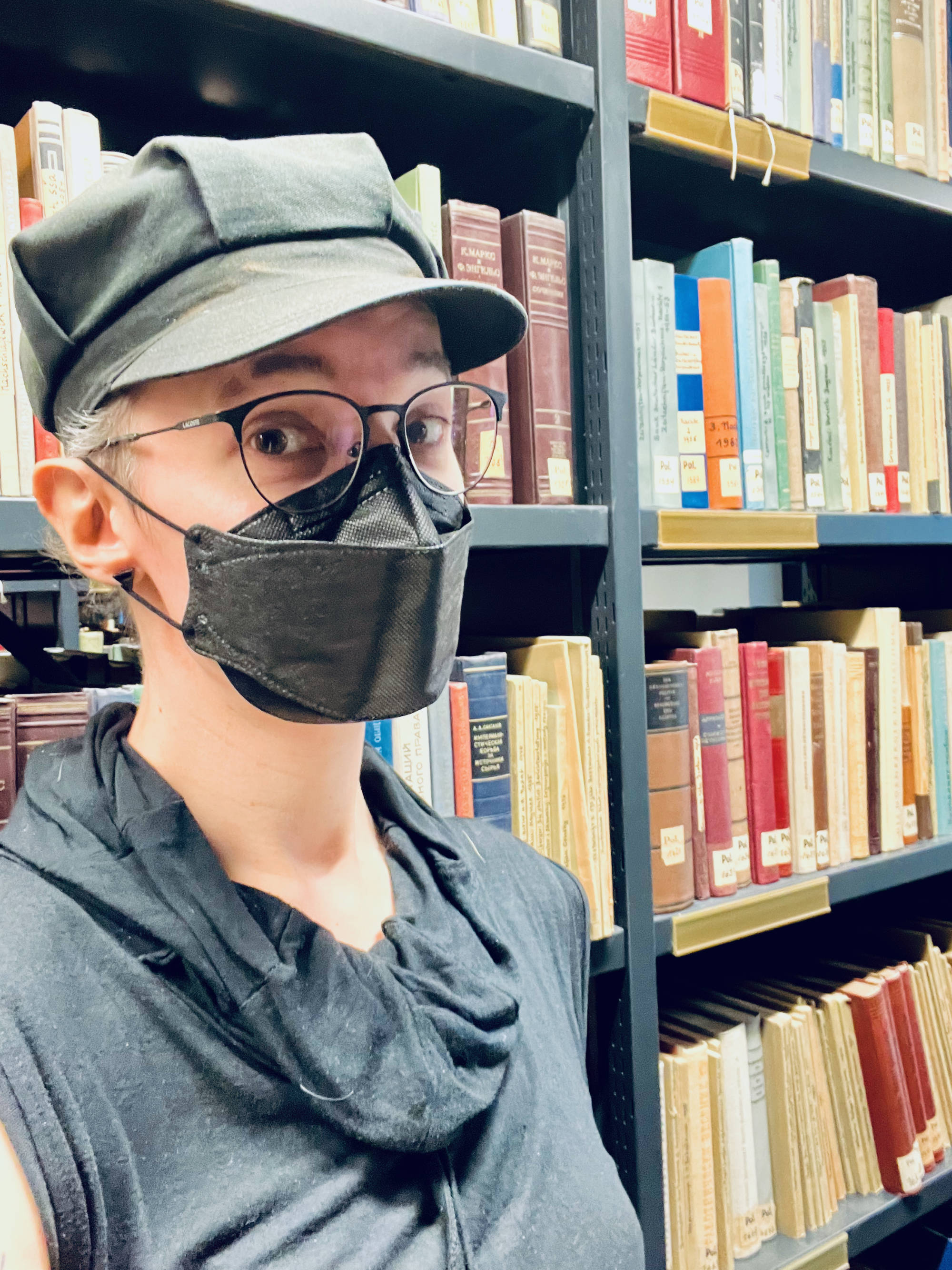 Selfie in a library full of old books