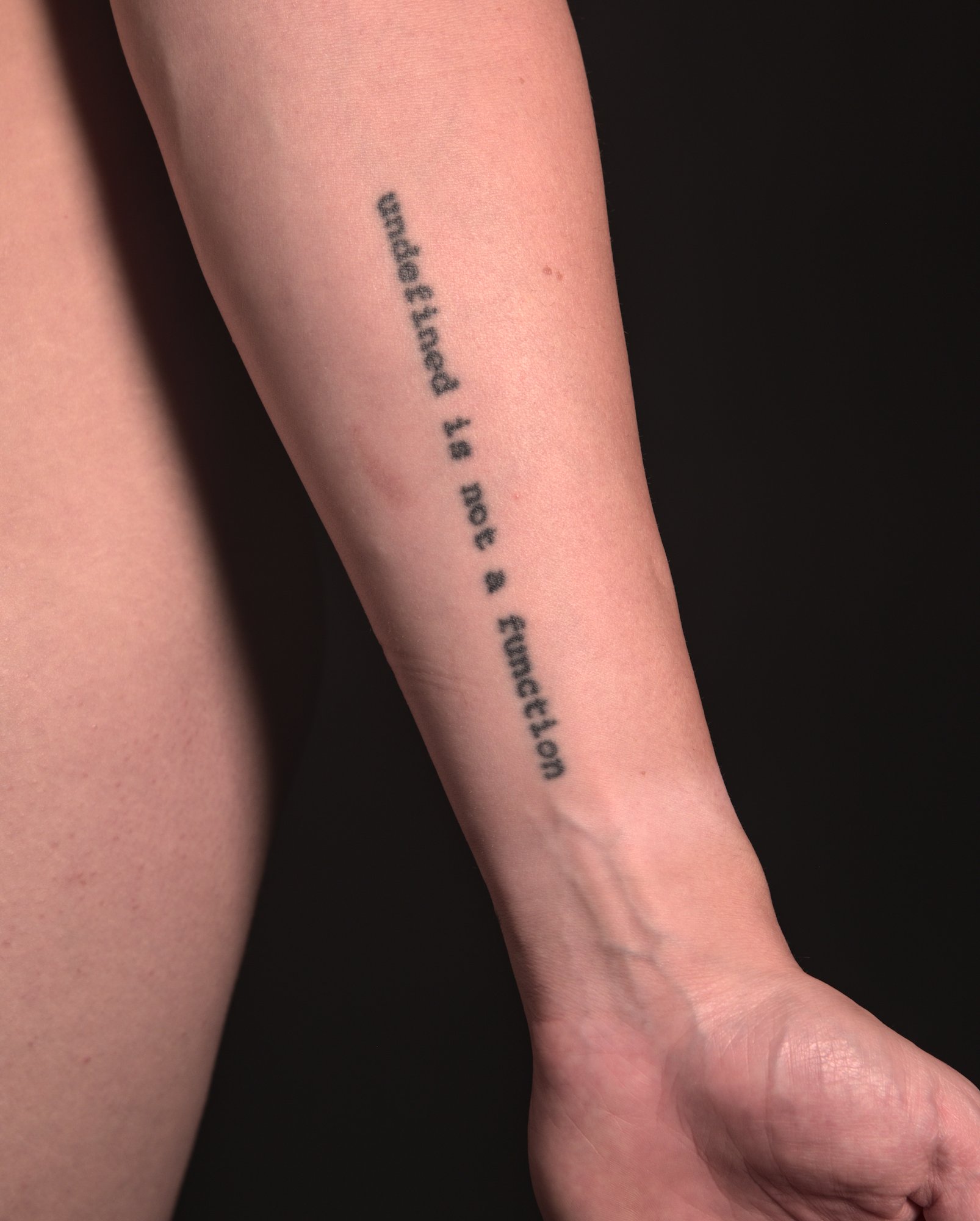 "undefined is not a function" tattooed on the inside of the left lower arm in a monospace font